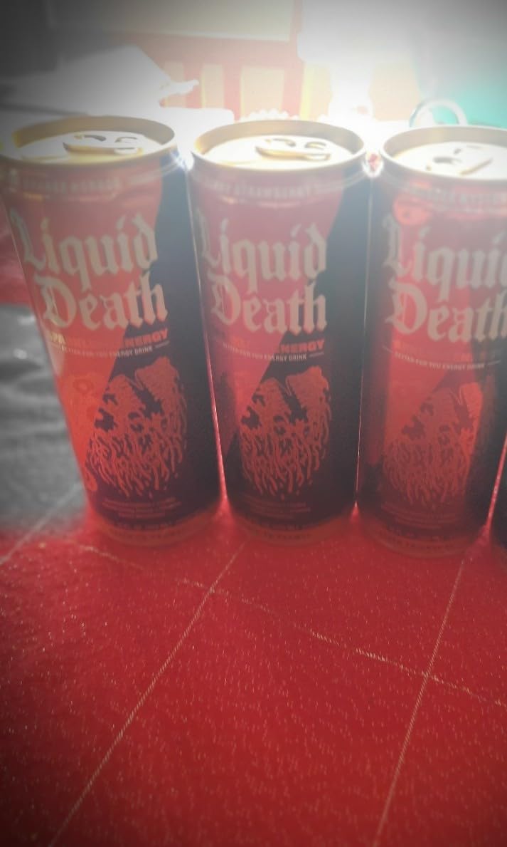 Liquid Death Sparkling Energy Variety Pack, Zero Sugar Energy Drink, Unextreme Caffeine 100mg, Essential Vitamins, 3 Flavors: Strawberry, Orange, and Murder Mystery, 12 Fl Oz (Pack of 12) customer photo 1