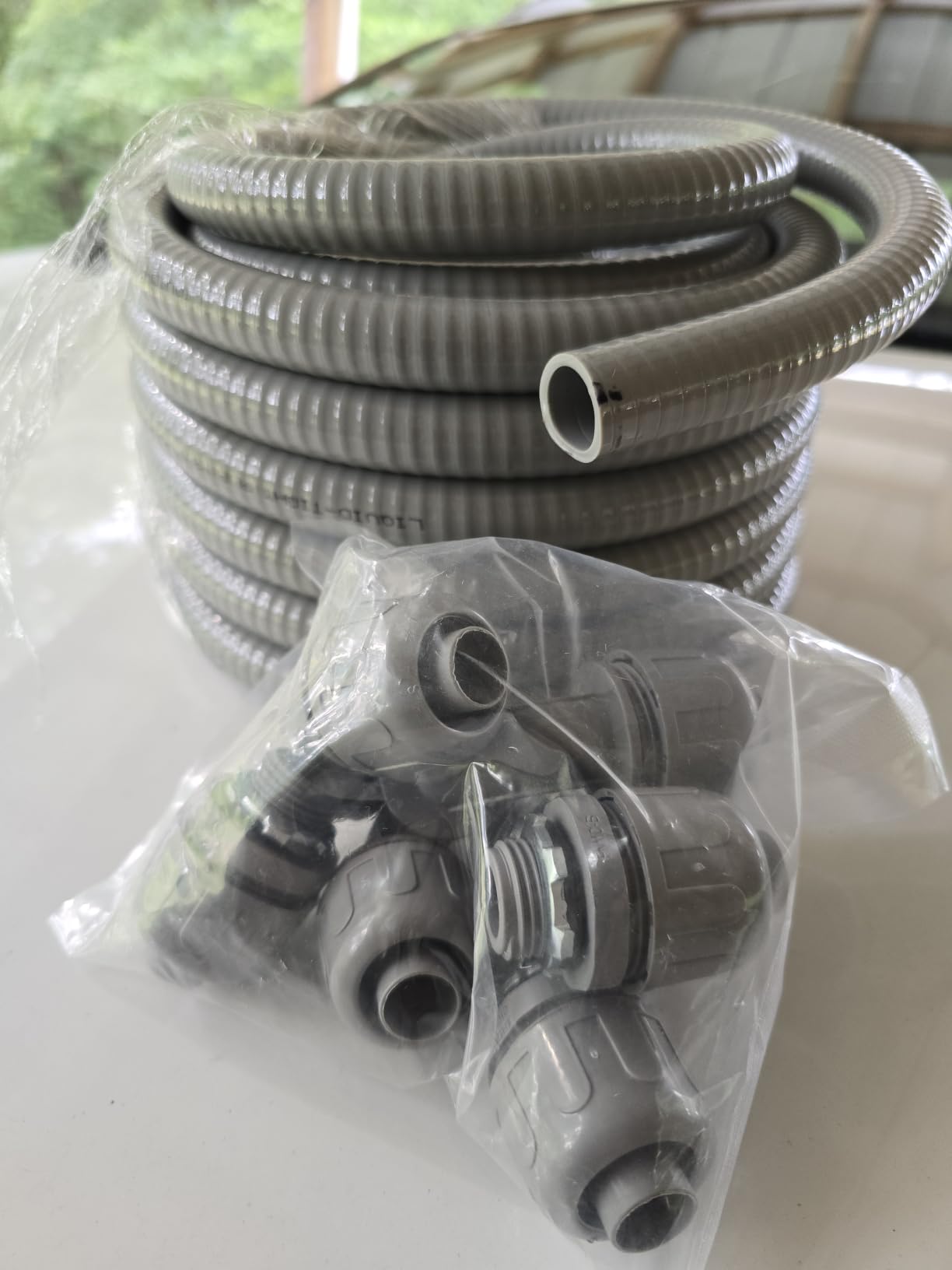 25 Ft Liquid-Tight Conduit and Connector Kit - 1/2 inch Flexible Non Metallic Liquid Tight Electrical Conduit and 4 Straight and 3 Angle Fittings Included. 1/2