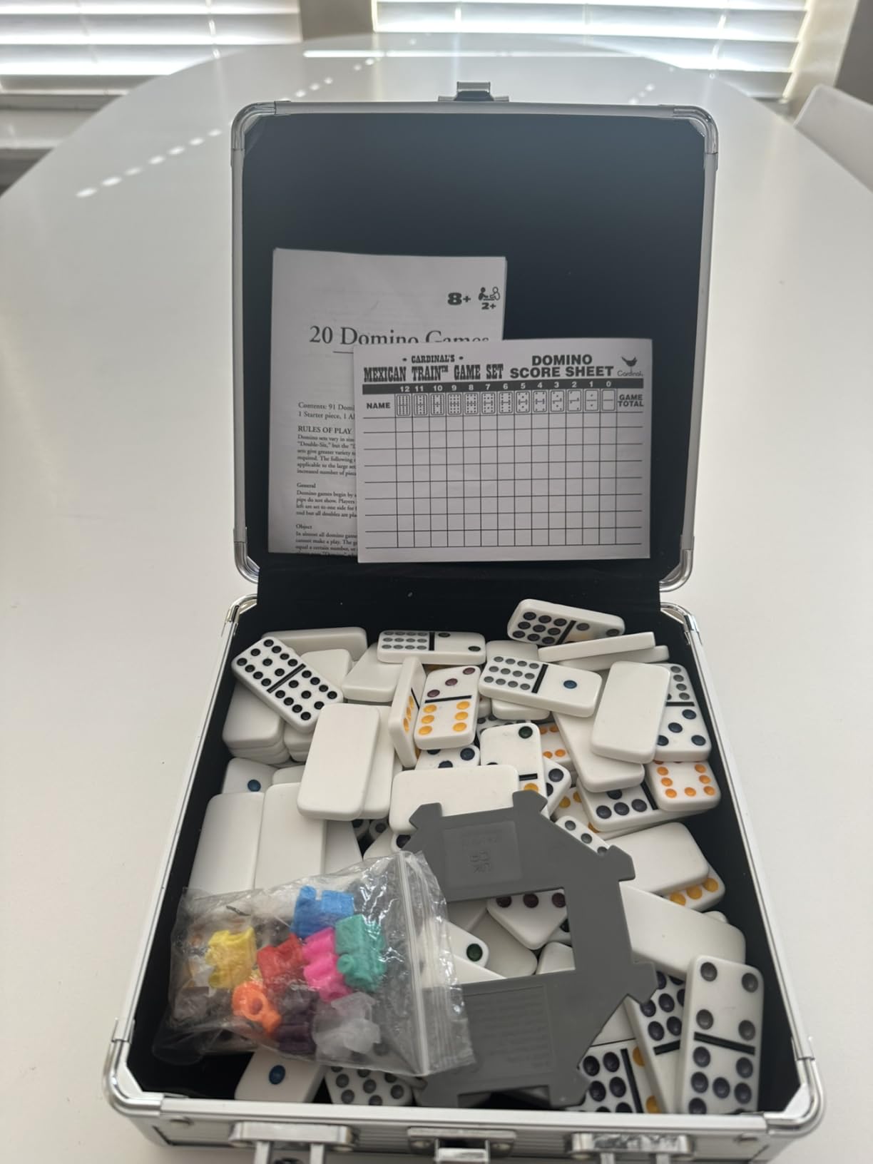 Spin Master Games Mexican Train Dominoes Set in Metal Case Classic Game | Includes 91 Dominoes, Plastic Trains & Case, Easy-to-Read Color-Coded Pips, Practice Matching Skills, 2-8 Players, Ages 8+ customer photo 1