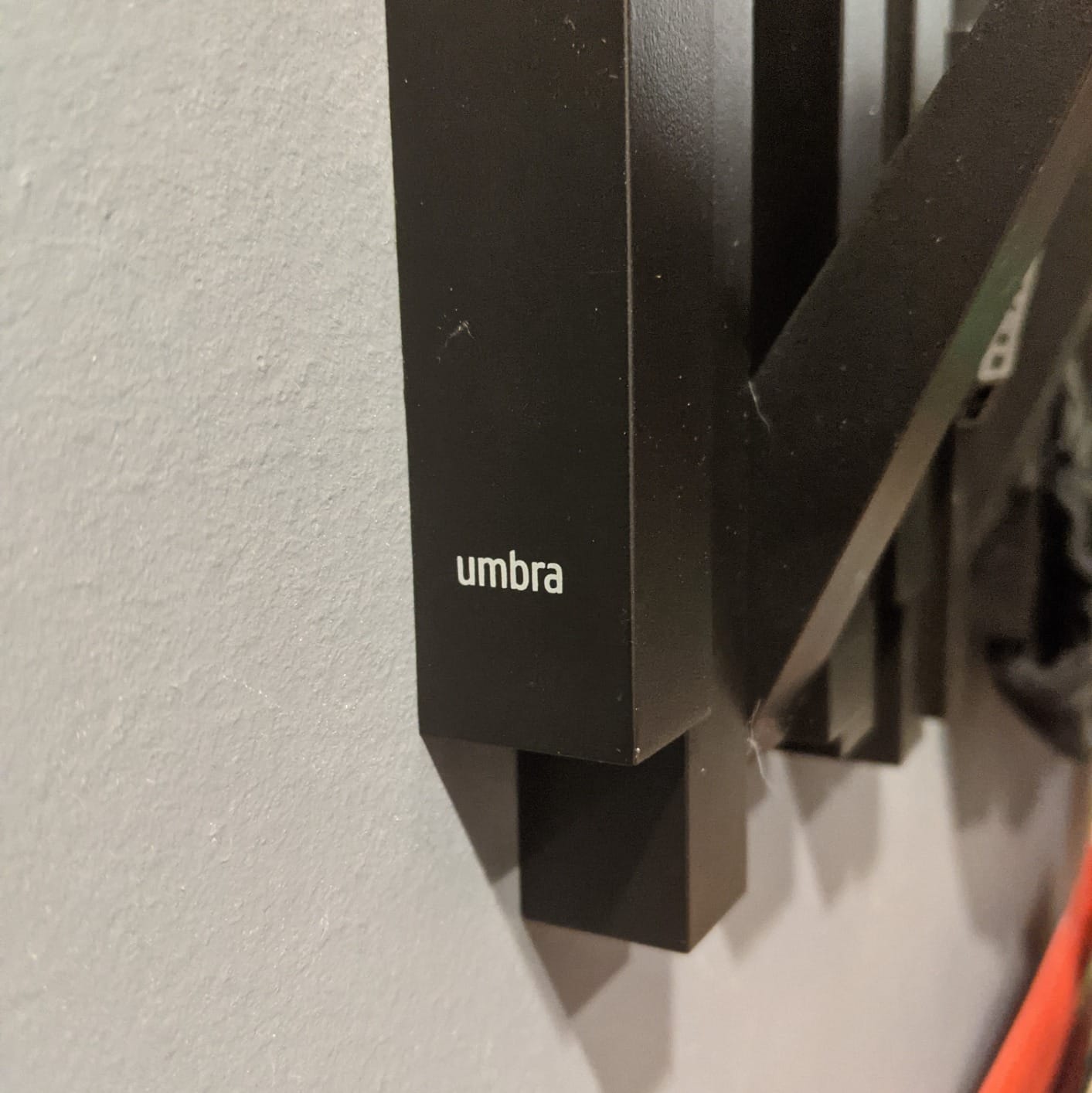 Umbra Sticks Wall Mount Coat Rack, 5 Hook Retractable Pegs, Black customer photo 2