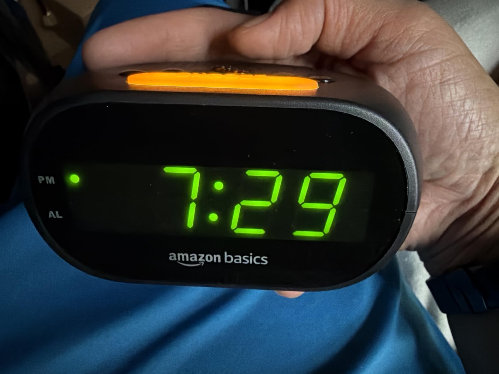 Amazon Basics Small Digital Oval Alarm Clock with LED Display, Nightlight, Snooze Function & Battery Backup, Black, 4.5 x 3.5 x 2.4 Inches customer photo 1