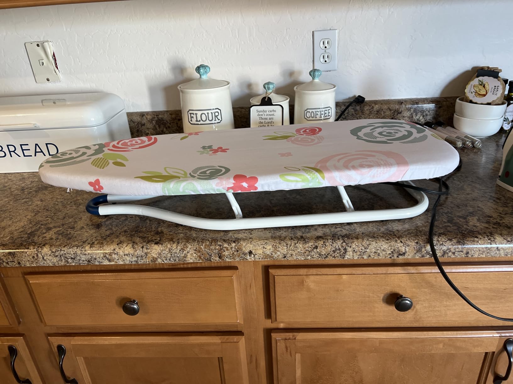 Amazon Basics Foldable Space Saving Ironing Board Tabletop with Non-Slip Feet, 77x29 cm, White, Floral customer photo 2