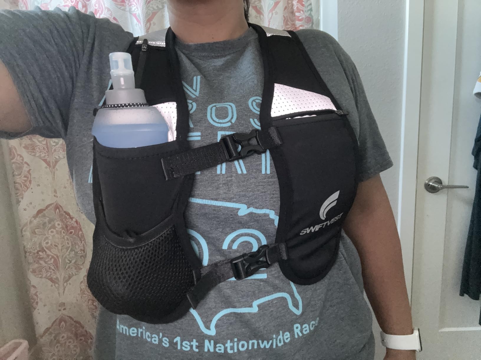Running Phone Holder Vest with 500ml/17oz Water Bottle | Reflective Hydration Vest | Adjustable | Light | 6 Pockets for Running Accessories | Unisex customer photo 2