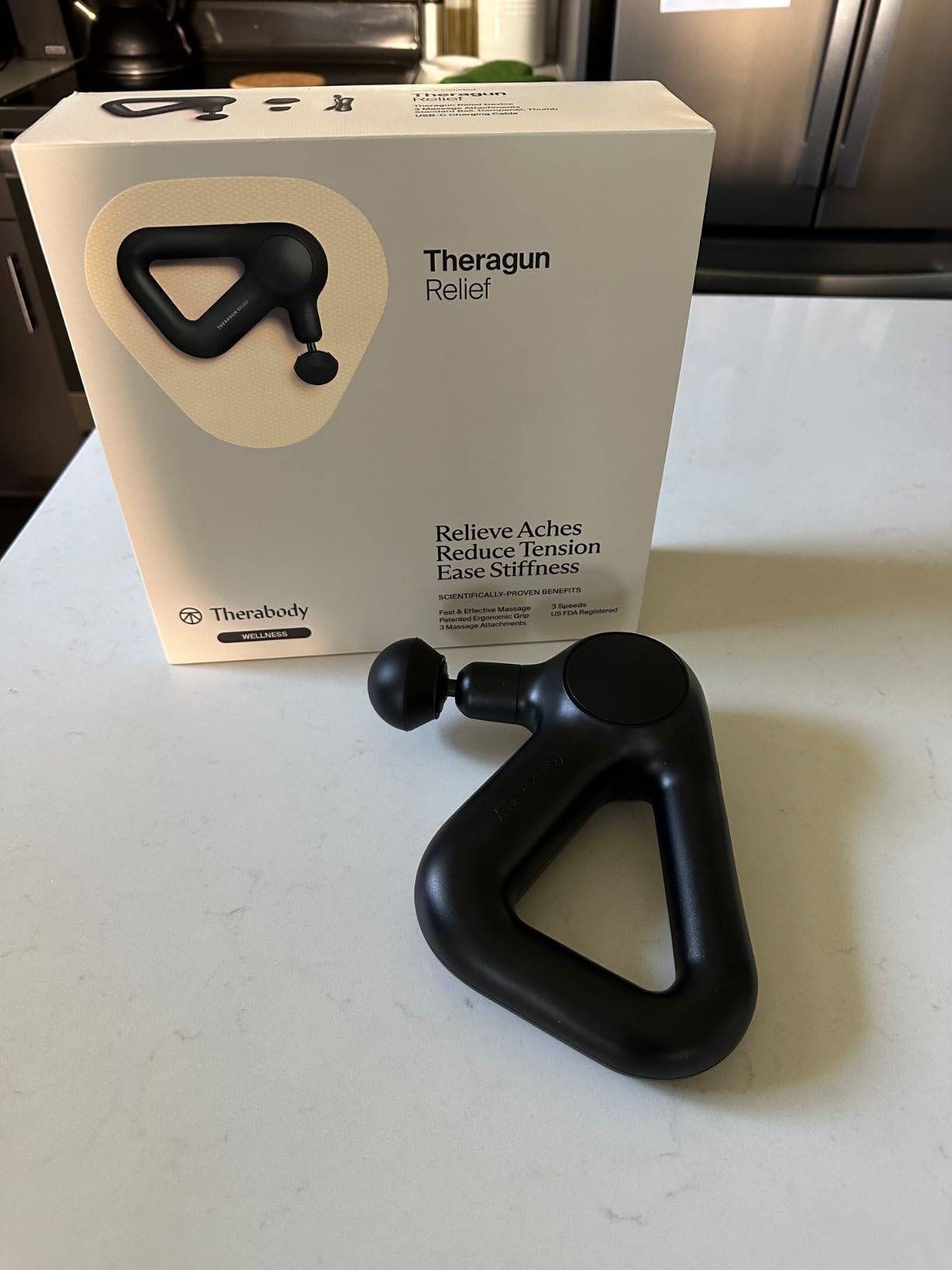 TheraGun Therabody Relief Massage Gun | for Daily Comfort | 3-Speed | Navy | Quiet Handheld Percussion Muscle Massager for Back, Leg & Shoulder Pain Relief. Lightweight, Easy to Use, Ergonomic Grip customer photo 2