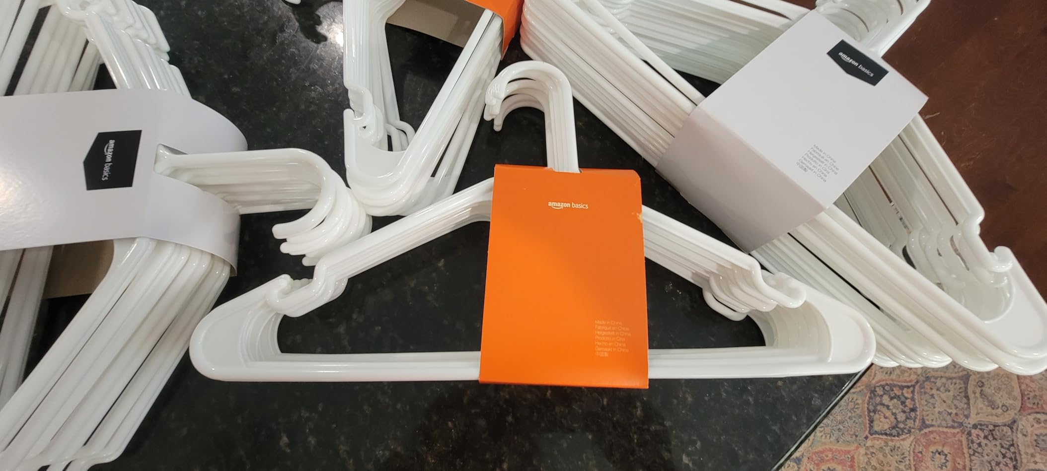 Amazon Basics Space Saving Plastic Clothes Hangers, Sturdy Closet Organizer for Shirts and Jackets, Adult Size, White, 50-Pack customer photo 1