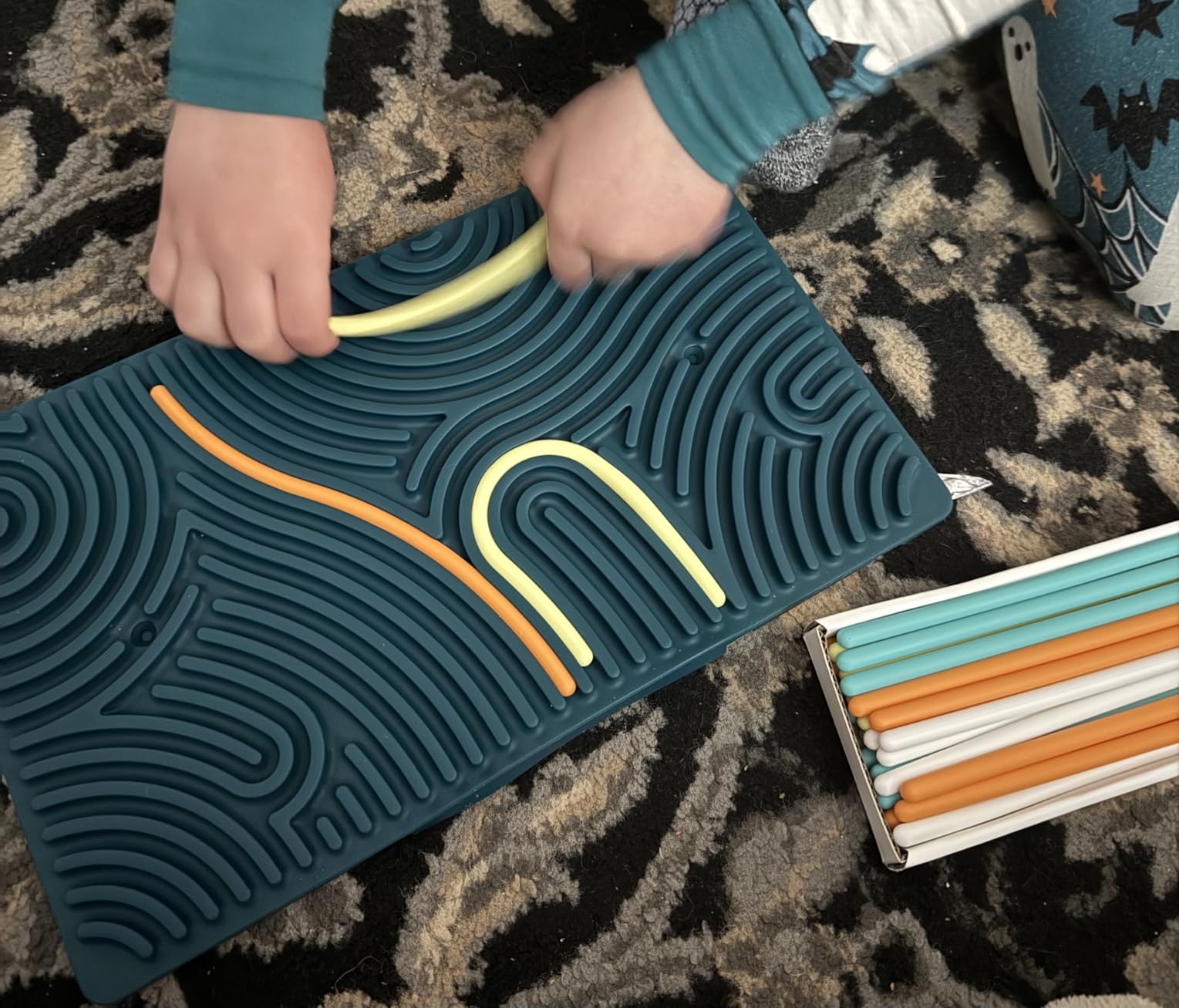 Pushpeel Sensory Activity Board: Silicone Fidget Toy for Calming, Stress, Anxiety, ADHD & Autism | Silent, No Mess | Kids 3+ & Adults | Includes Portable Travel Bag & 11 Strings customer photo 2