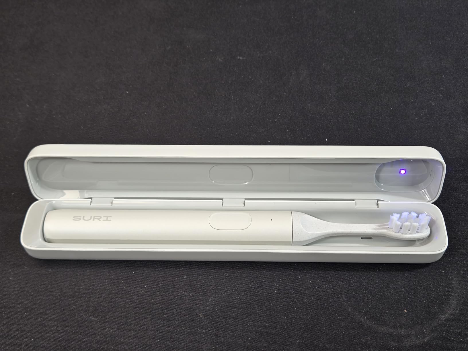 SURI Pro Sonic Electric Toothbrush | Over 4+ Weeks Battery | UV Cleaning Travel Case | Pressure Sensor | Aluminium Body | 2-Minute Timer | Plant-Based Head | Green customer photo 1